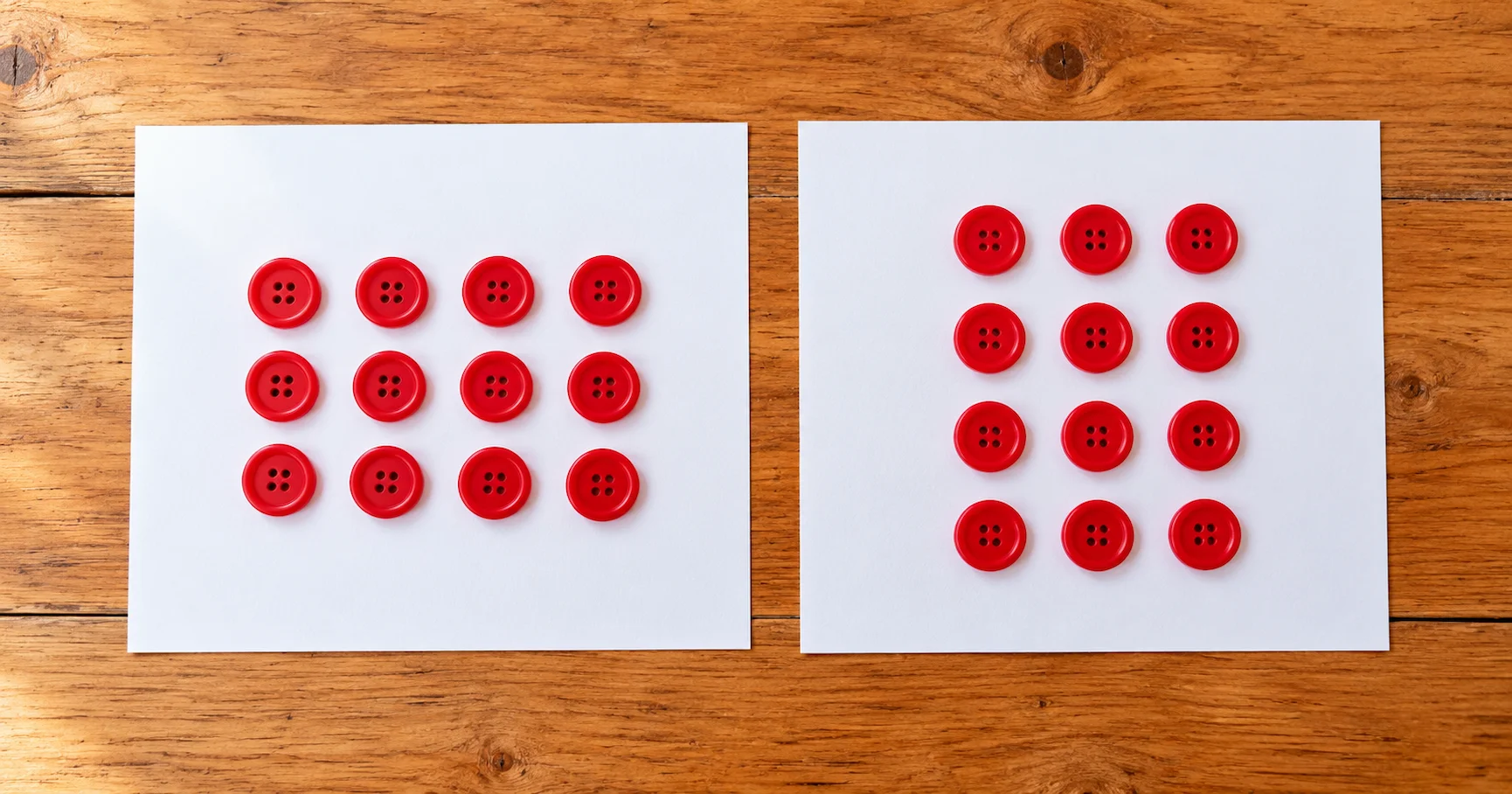 Overhead view of two arrays made from red buttons on a table: 3 rows of 4 on the left and 4 rows of 3 on the right, both totalling 12